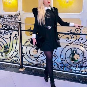 Black knit mini dress with white collar and cuffs. Size small